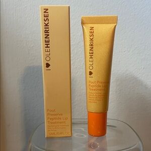 Ole Henriksen Lip Treatment in Gold and Orange
